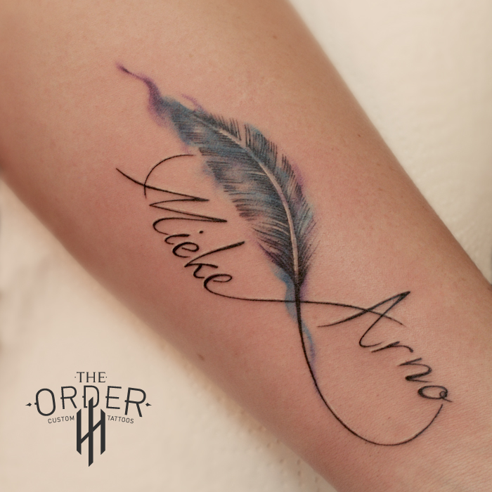 Watercolor feather and names tattoo - The ORDER - The Order Custom Tattoos